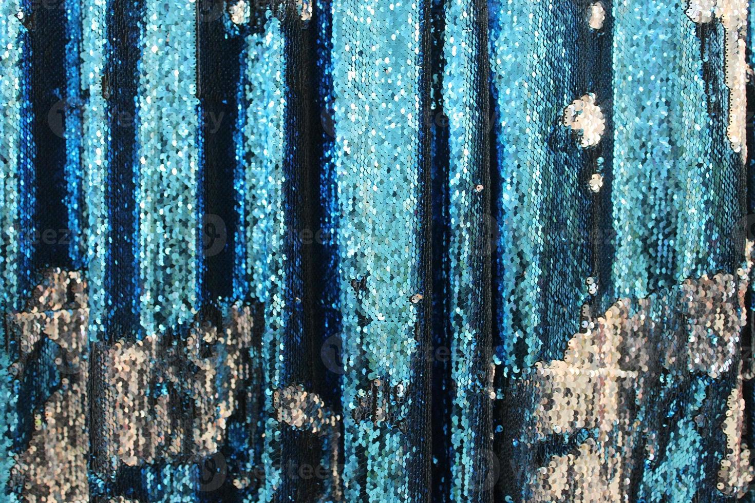 Detailed close up view on samples of cloth and fabrics in different colors found at a fabrics market photo