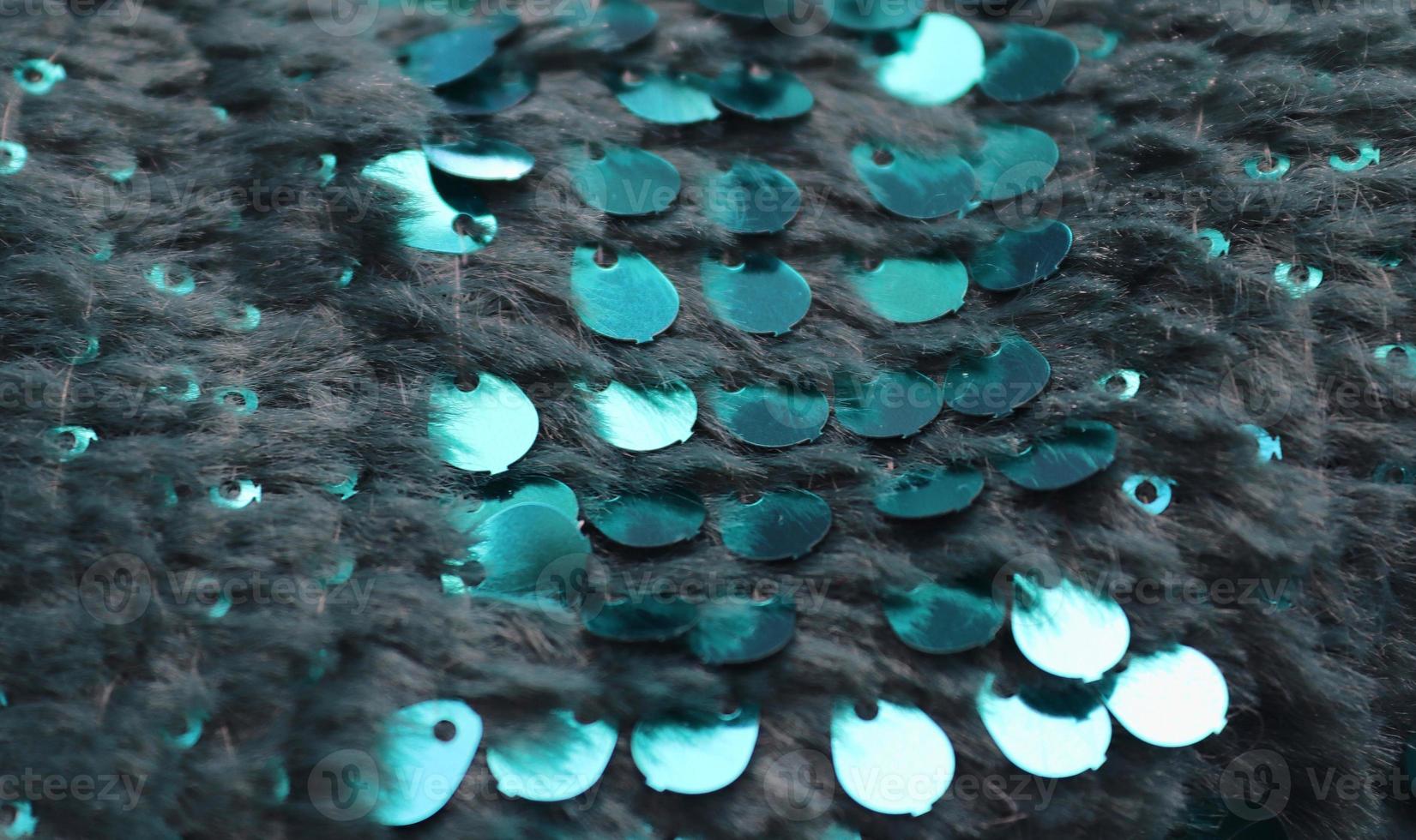 Detailed close up view on samples of cloth and fabrics in different colors found at a fabrics market photo