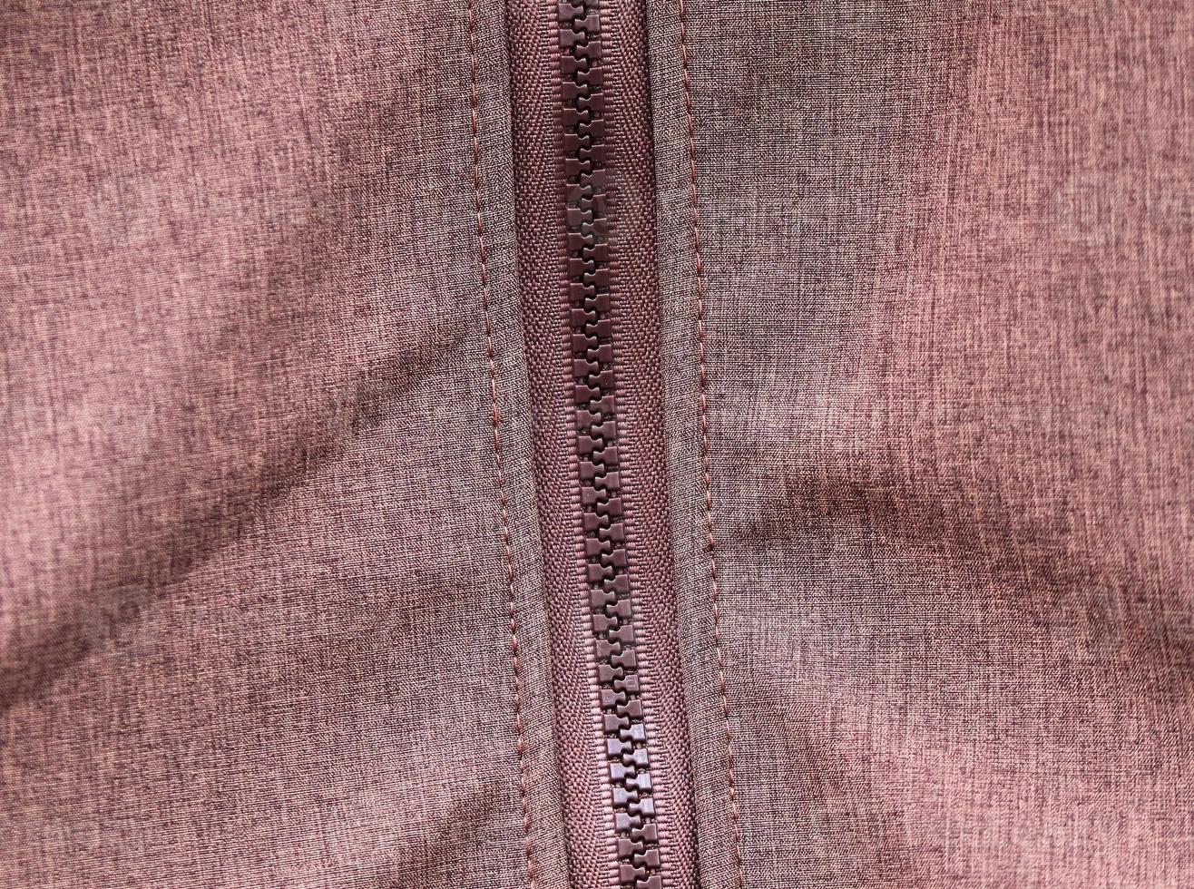 Detailed close up view on samples of cloth and fabrics in different colors found at a fabrics market photo
