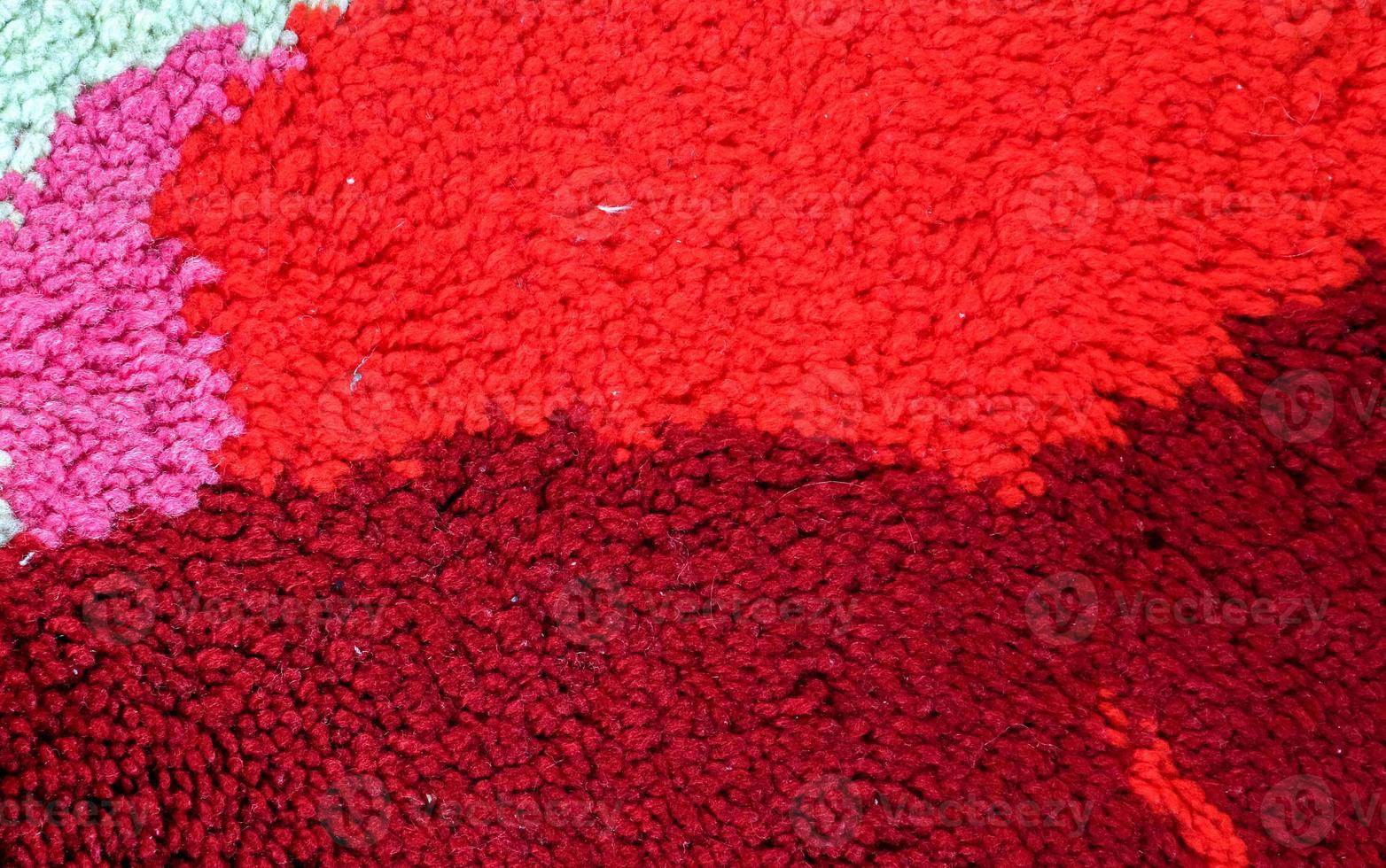Detailed close up view on samples of cloth and fabrics in different colors found at a fabrics market photo