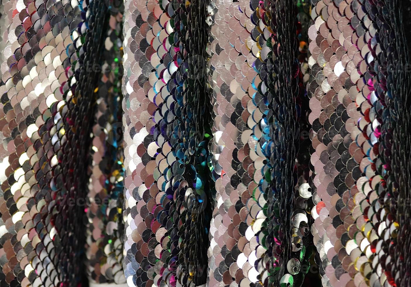 Detailed close up view on samples of cloth and fabrics in different colors found at a fabrics market photo