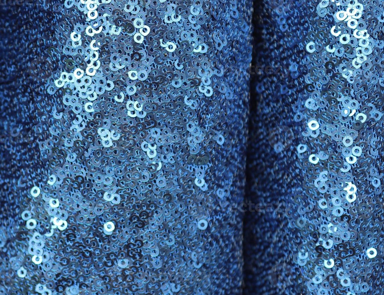 Detailed close up view on samples of cloth and fabrics in different colors found at a fabrics market photo