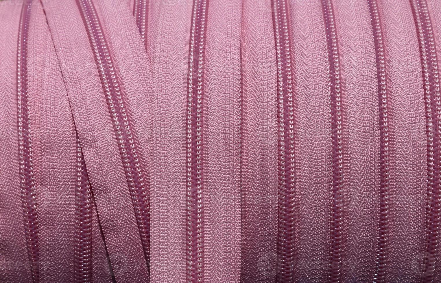 Detailed close up view on samples of cloth and fabrics in different colors found at a fabrics market photo