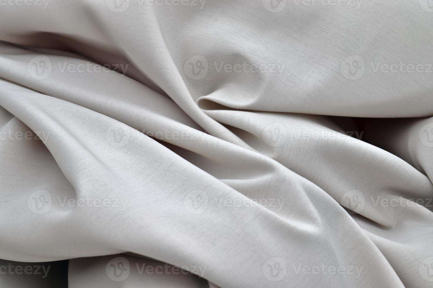 Detailed close up view on samples of cloth and fabrics in different colors found at a fabrics market photo