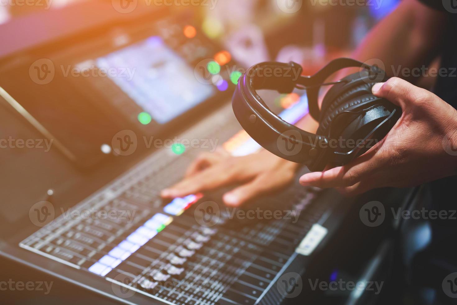 DJ mixing music on stage, concert photo