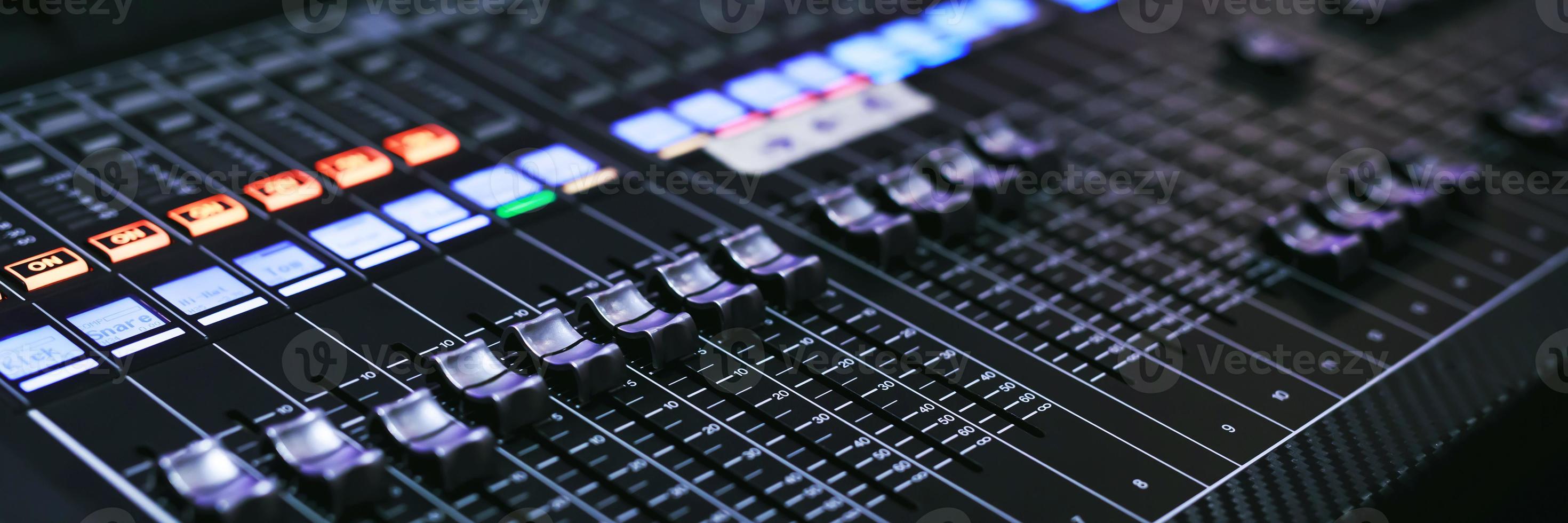 Recording Studio Mixing Desk with Music Producer on the concert stage photo