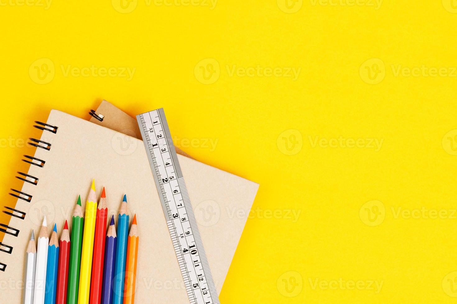 Top view notebooks and accessories studying in the library at school yellow background idea education photo