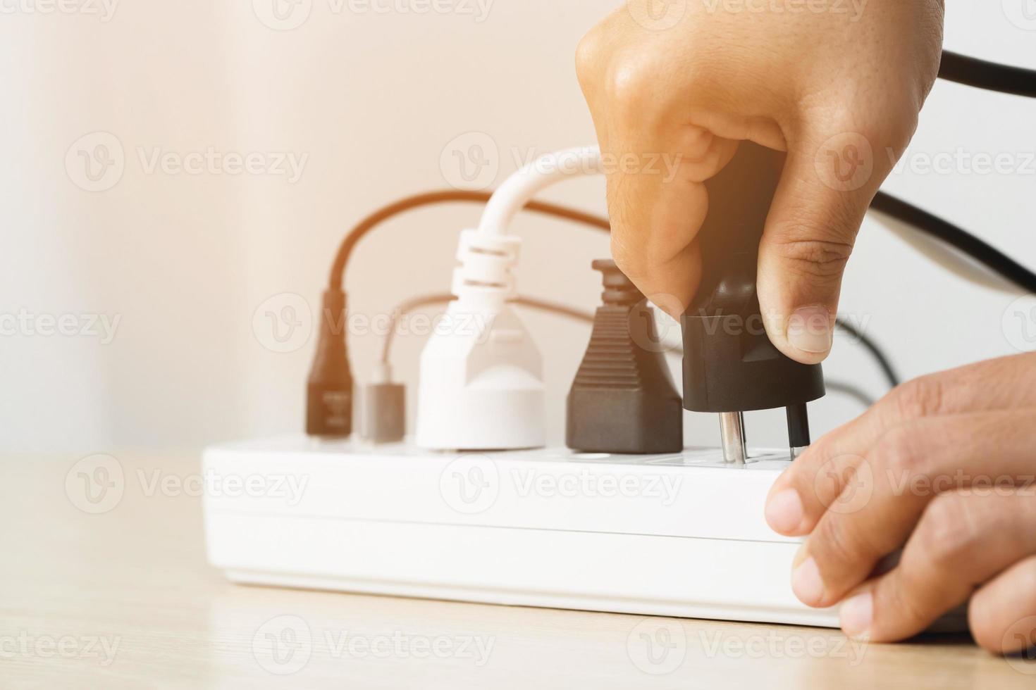 Electrical appliances plugs full of all plugs or plugs together. Because of the risk of causing a short circuit from high heat accumulated in the wires. photo