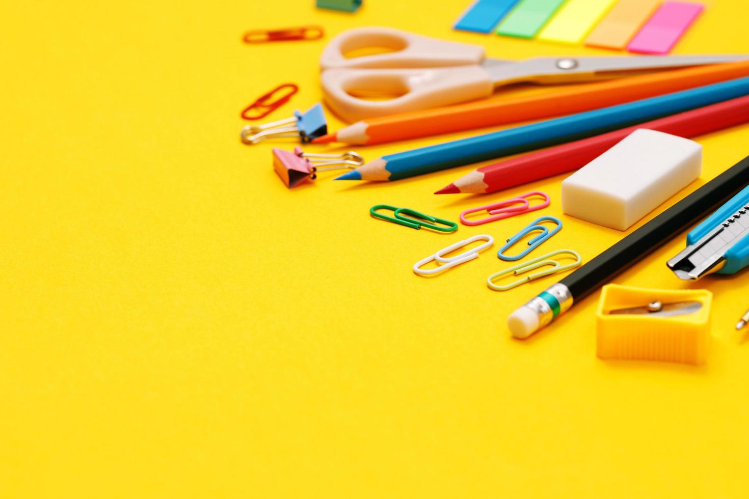 Top view notebooks and accessories studying in the library at school yellow background idea education photo