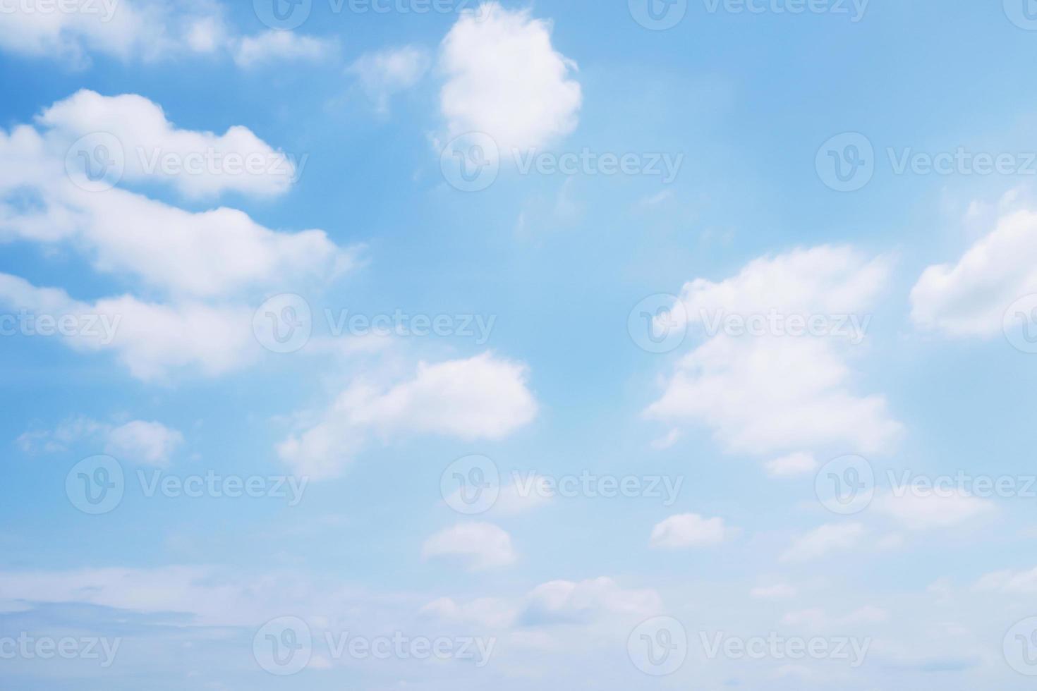 Beautiful clear blue sky background with tiny plain white cloud on morning time rays sunlight. space for text. soft focus. photo