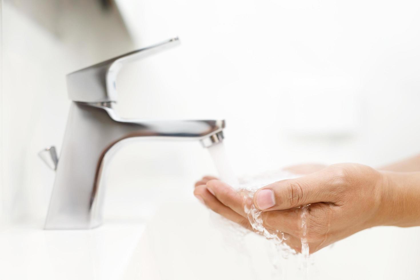 Hygiene. Cleaning Hands. Washing hands with soap under the faucet with water Pay dirt. photo