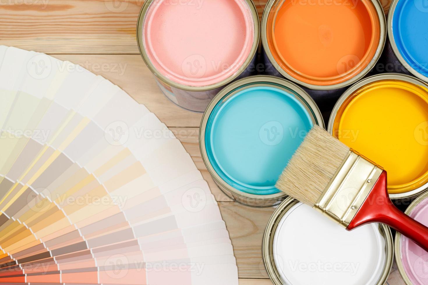 A painter is choosing a paint shade for the interior of the house's walls. with interior photo