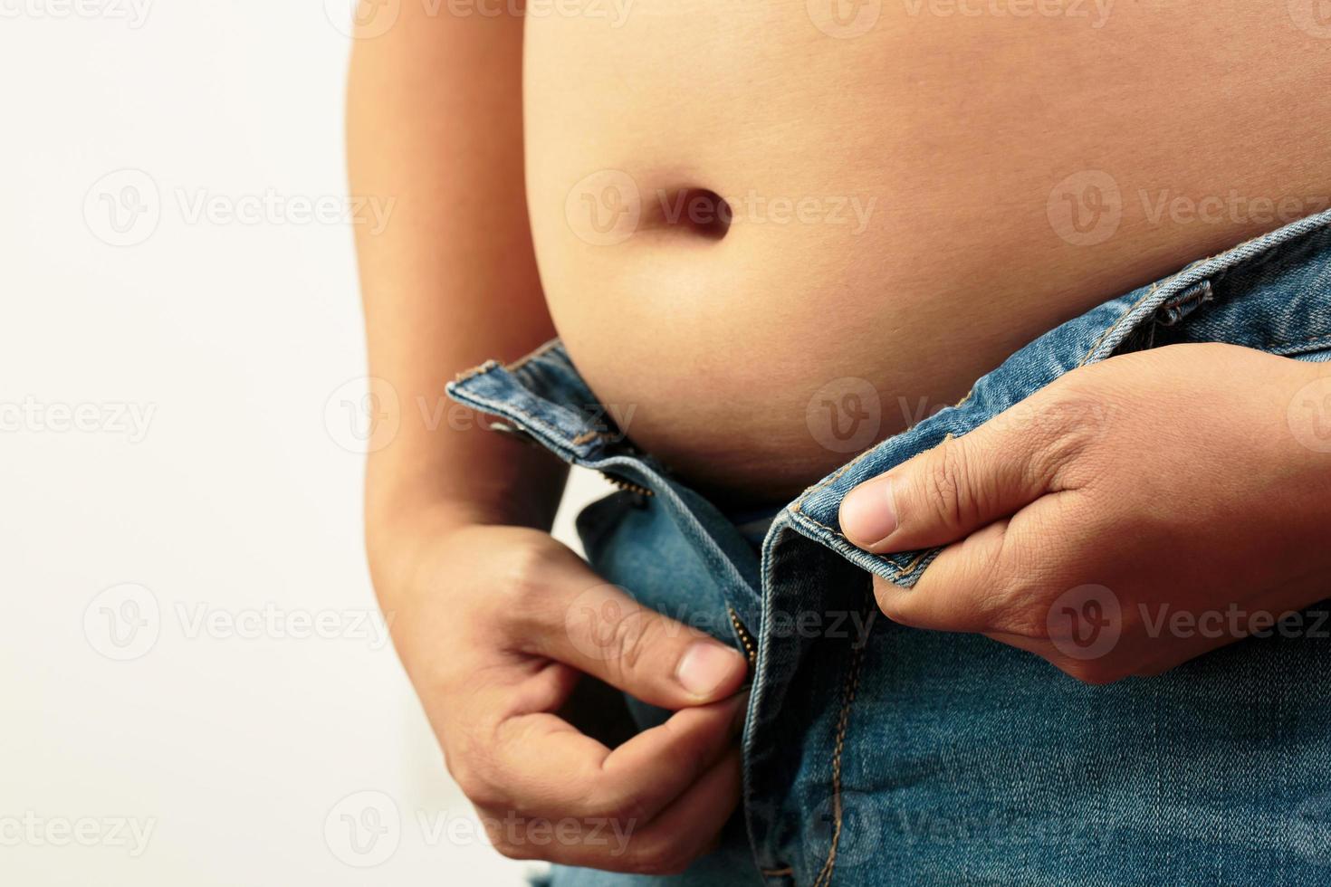 Fat man has excess fat, he is dieting and losing weight. photo