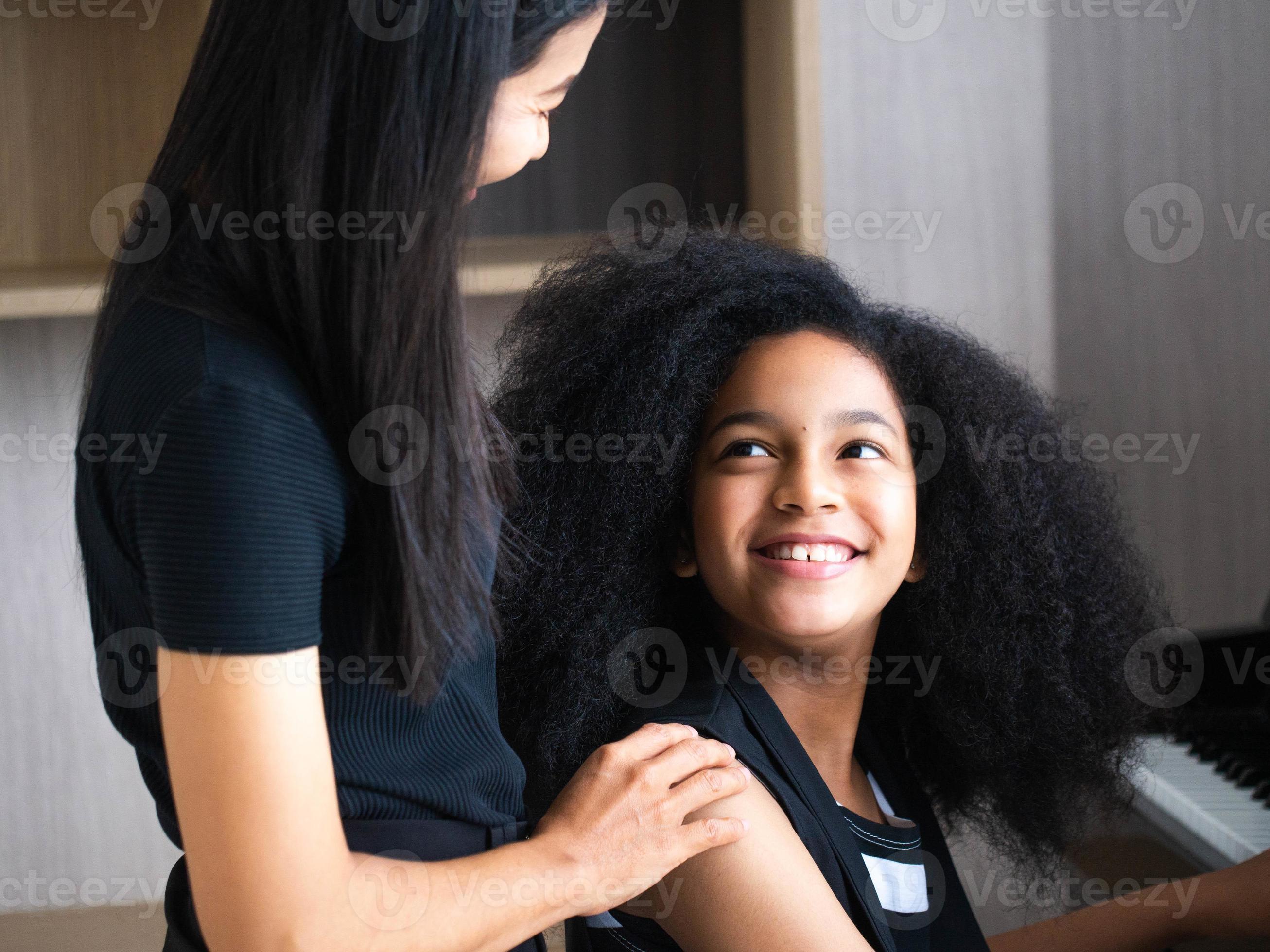 Family mother love hug son girl child person young adult together beautiful  activity play learn education piano music song living indoor home happy  smile lifestyle fun enjoy 11346999 Stock Photo at Vecteezy