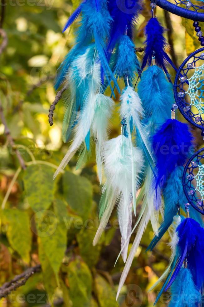 Handmade dream catcher with feathers threads and beads rope hanging photo
