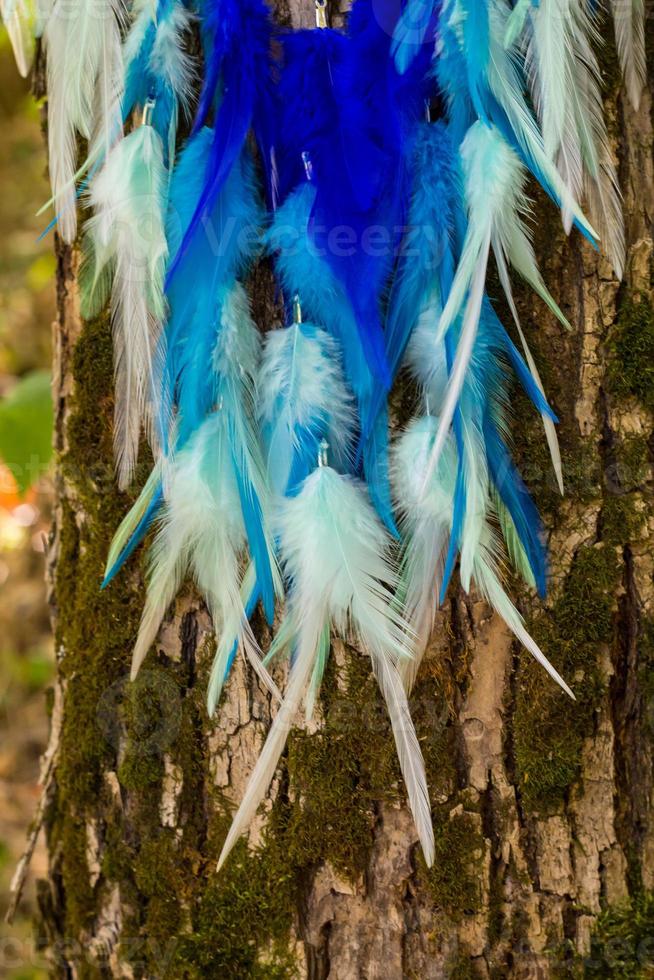 Handmade dream catcher with feathers threads and beads rope hanging photo