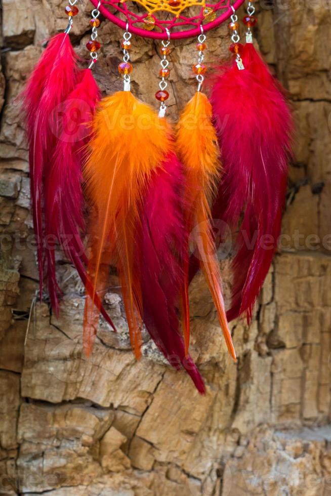 Handmade dream catcher with feathers threads and beads rope hanging photo