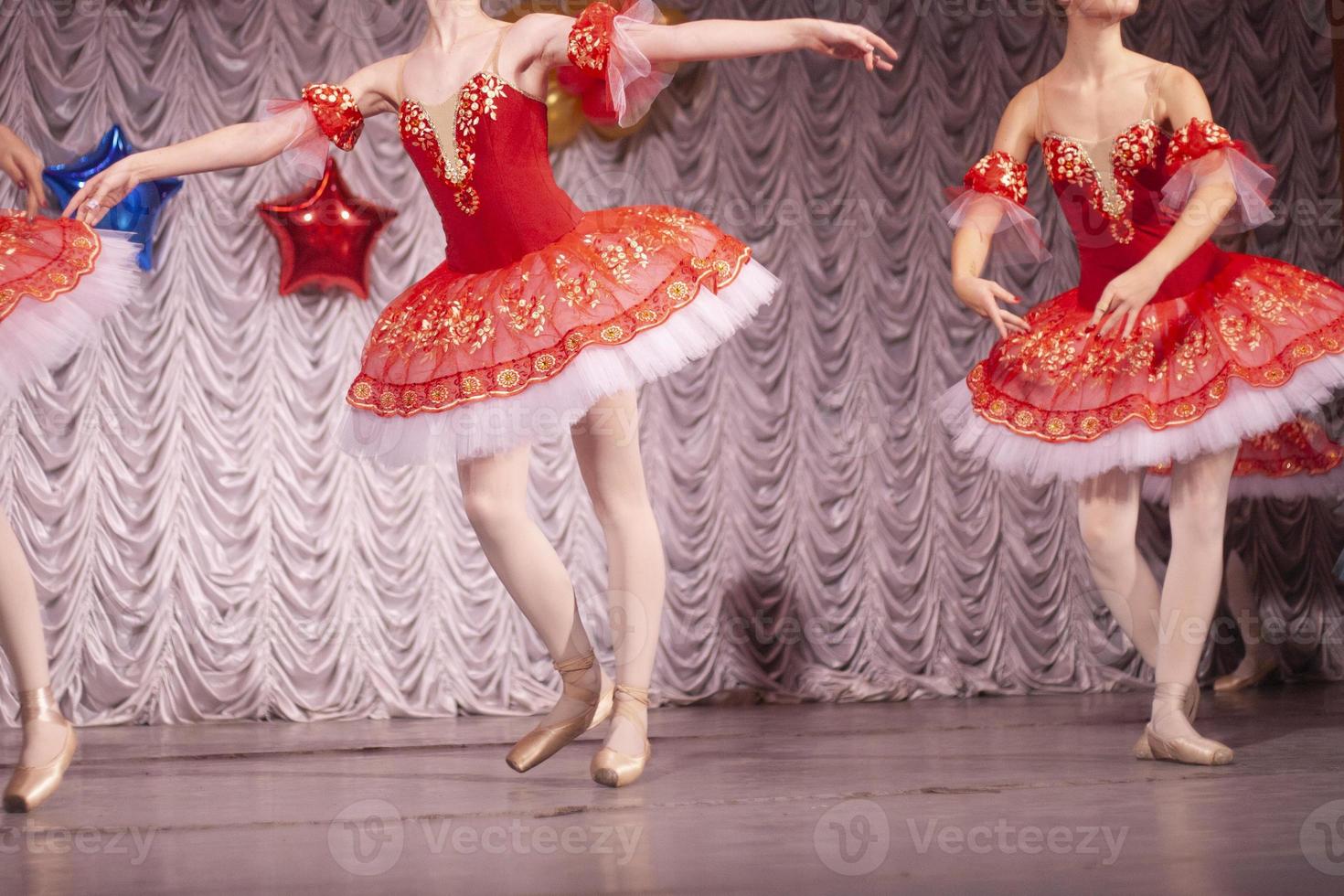 Ballerinas on stage. Dancers perform in ballet. photo