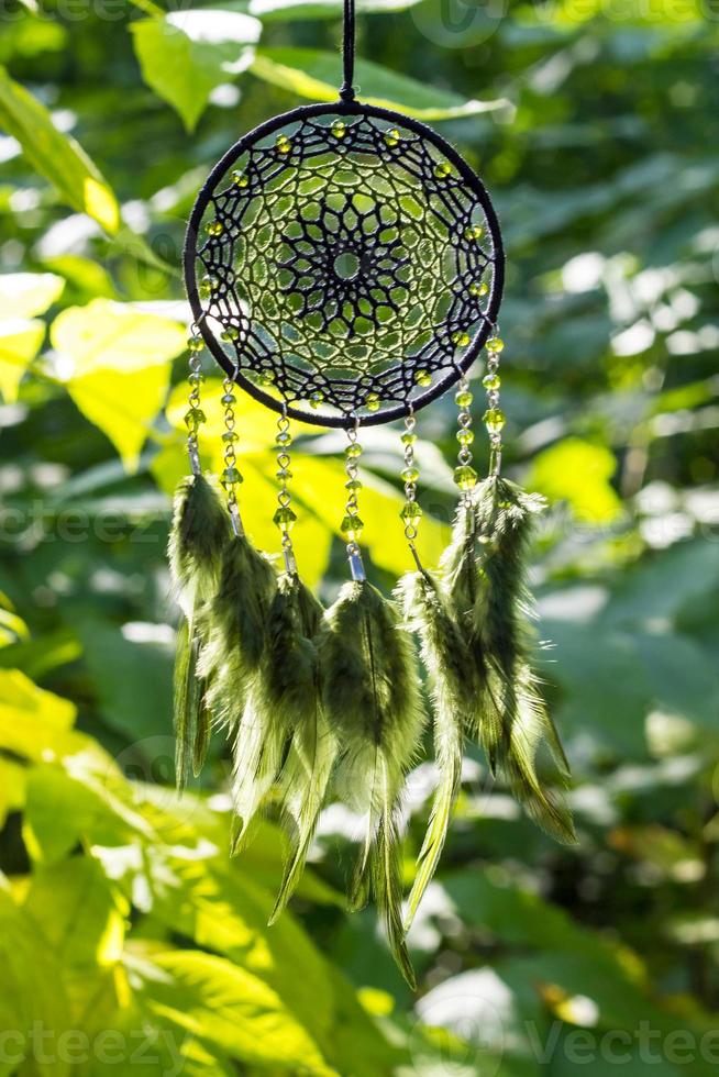 Handmade dream catcher with feathers threads and beads rope hanging photo