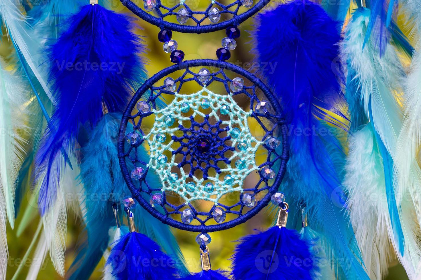 Handmade dream catcher with feathers threads and beads rope hanging photo