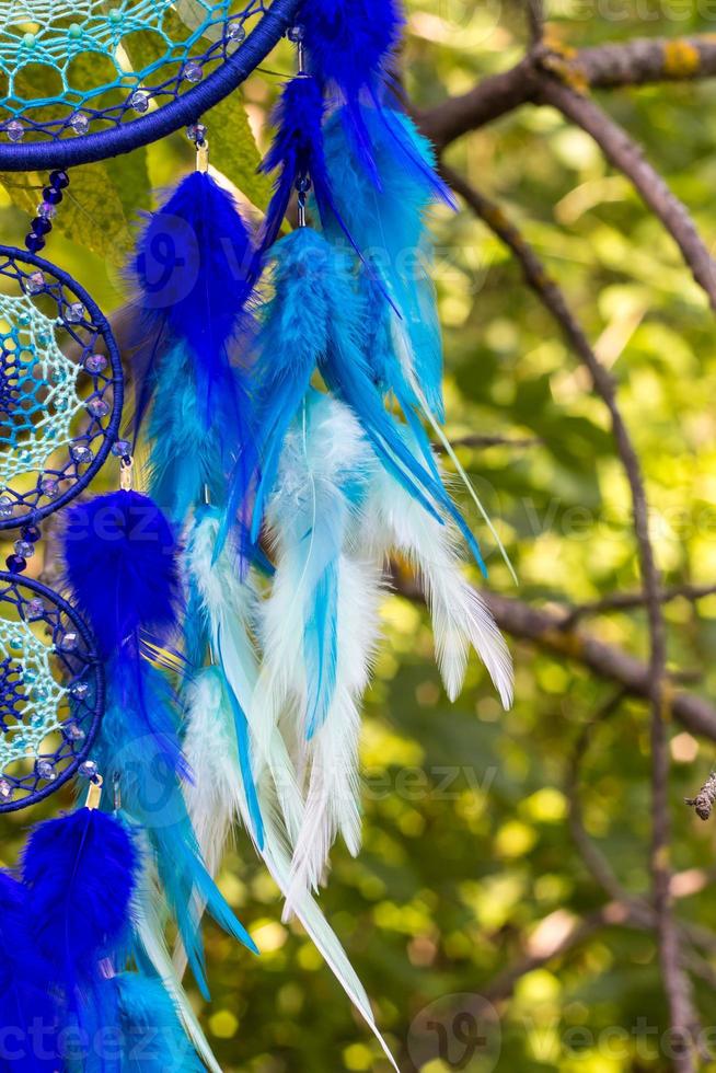 Handmade dream catcher with feathers threads and beads rope hanging photo
