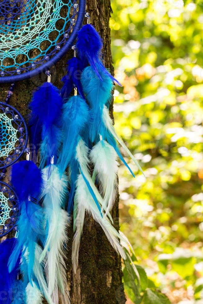 Handmade dream catcher with feathers threads and beads rope hanging photo