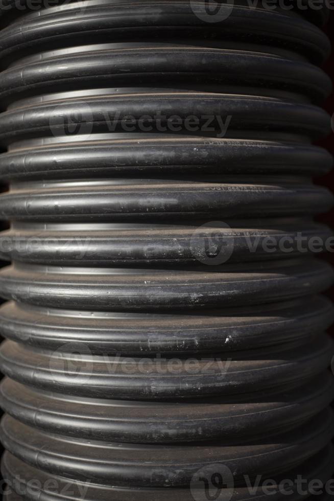 Sewer. Plastic corrugated pipe. Product for fluid flow transmission. Details of industrial facility. photo