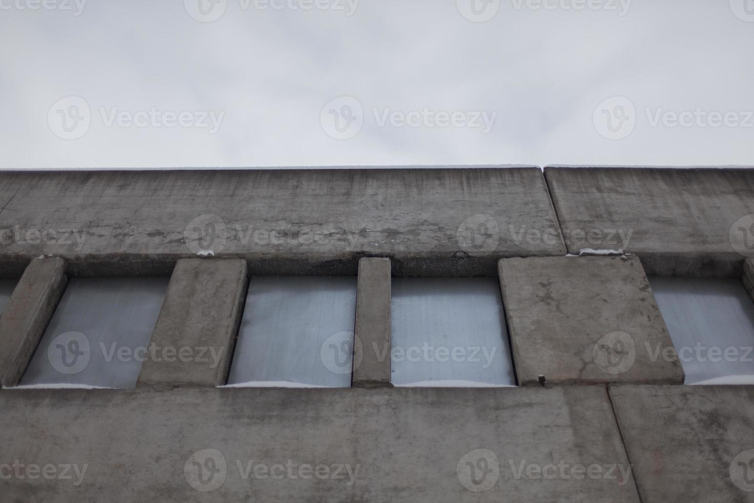 Abandoned building. Windows are tightly sealed with steel sheet. Locked building. photo