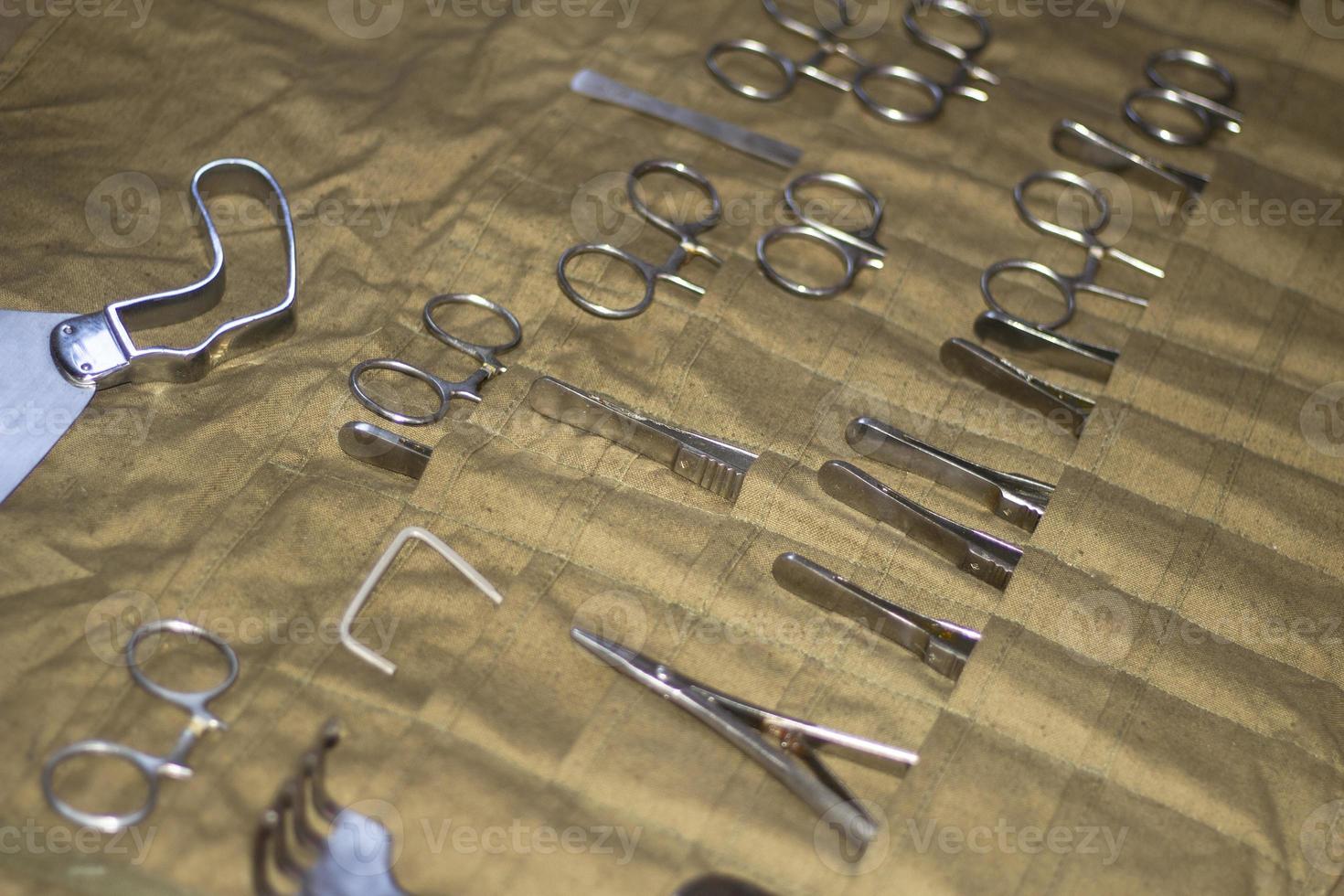 Surgical instruments. Set of medical supplies. Tools made of chrome steel. Medical kit during World War II. Vintage object. photo