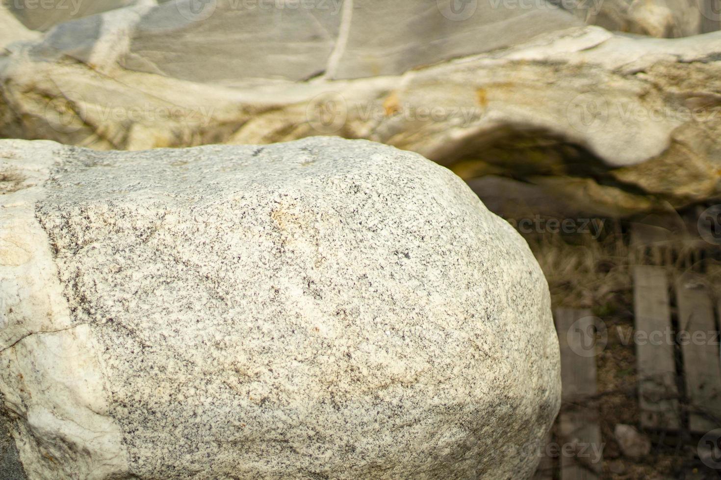 Stone shop. Selection of rocks of different breeds. The stones lie on the site. Selected pieces of rock to decorate the park. photo