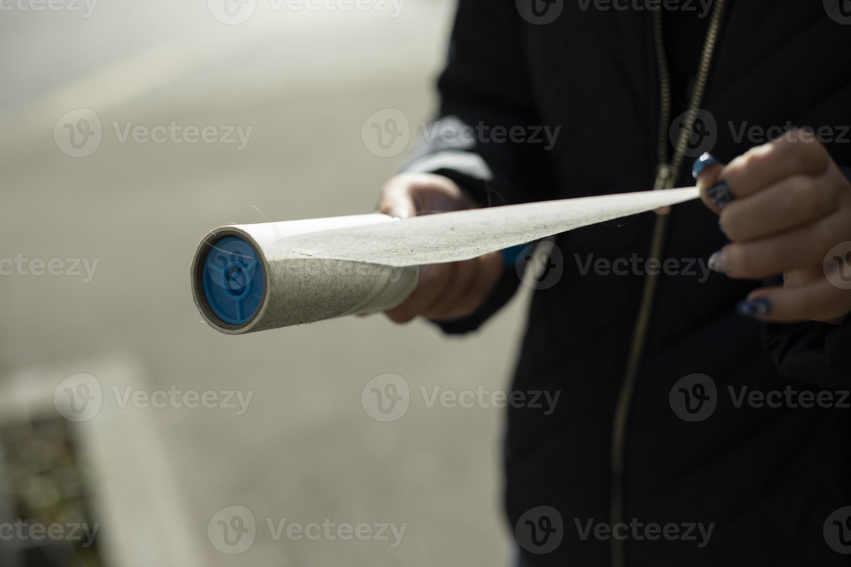 Adhesive tape to remove wool from clothes. Tool for cleaning clothes