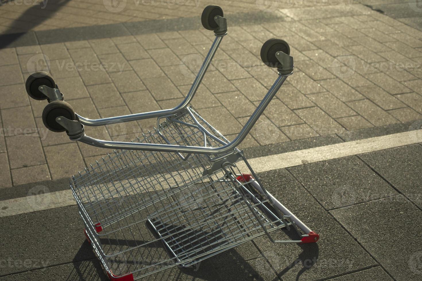 Inverted trading basket. Empty consumer basket in Russia. Commodity box on wheels. Place of storage of products. An abandoned object. photo