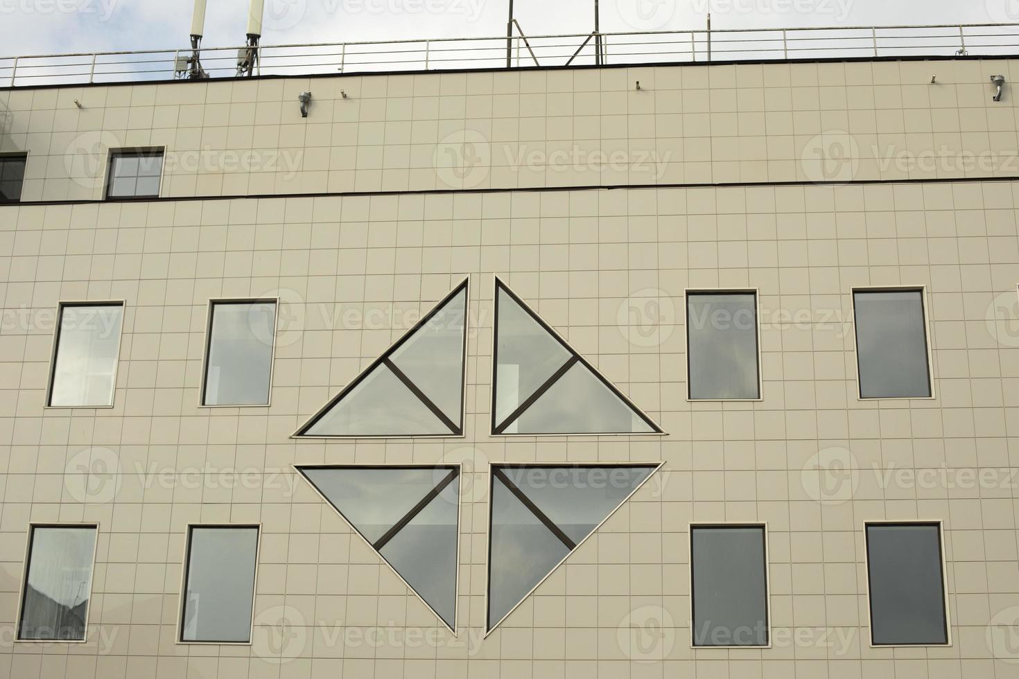 Windows in the office building. Facing panel in modern architecture. photo