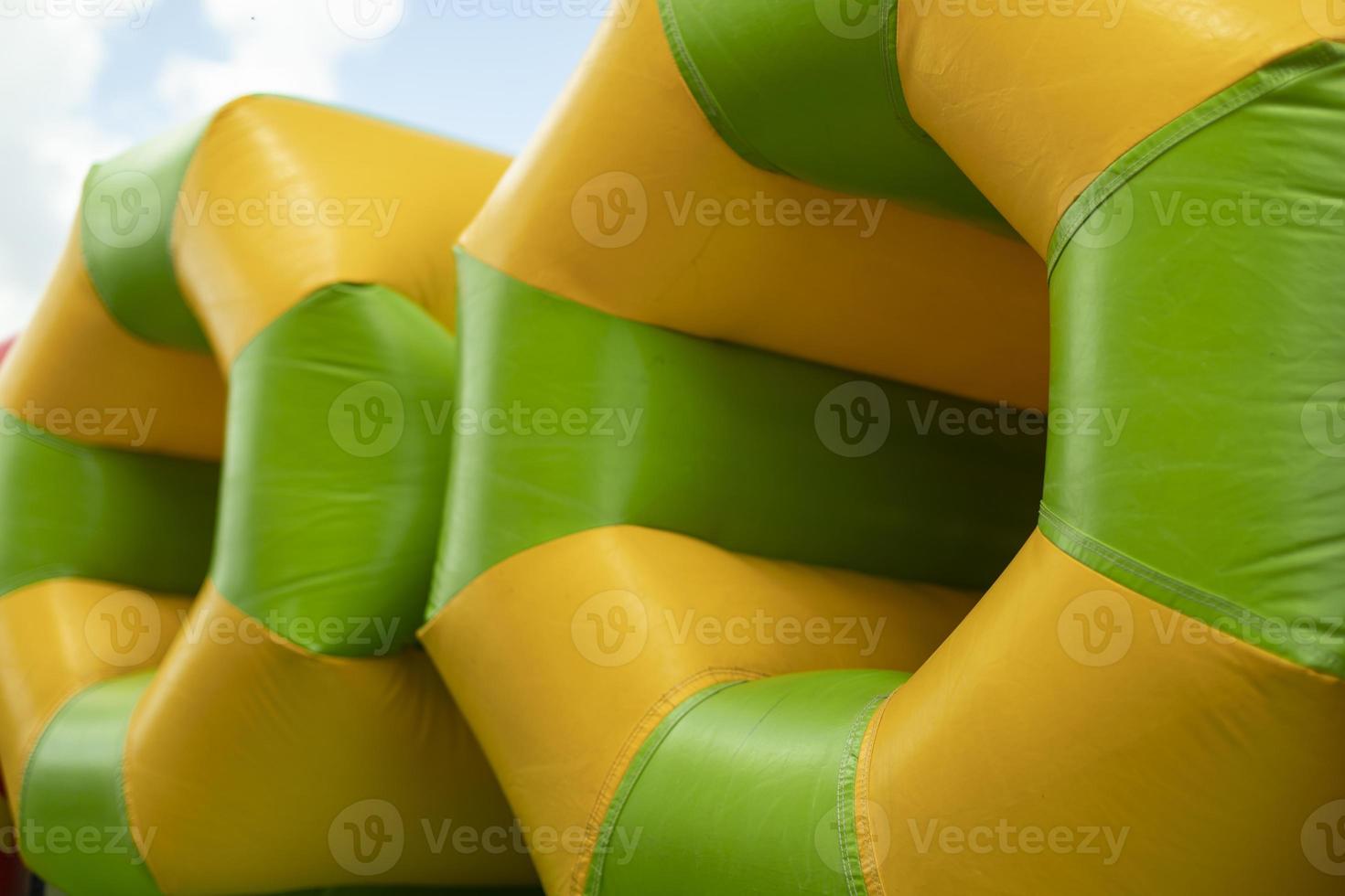 Inflatable pipe on playground. Obstacle course in amusement park
