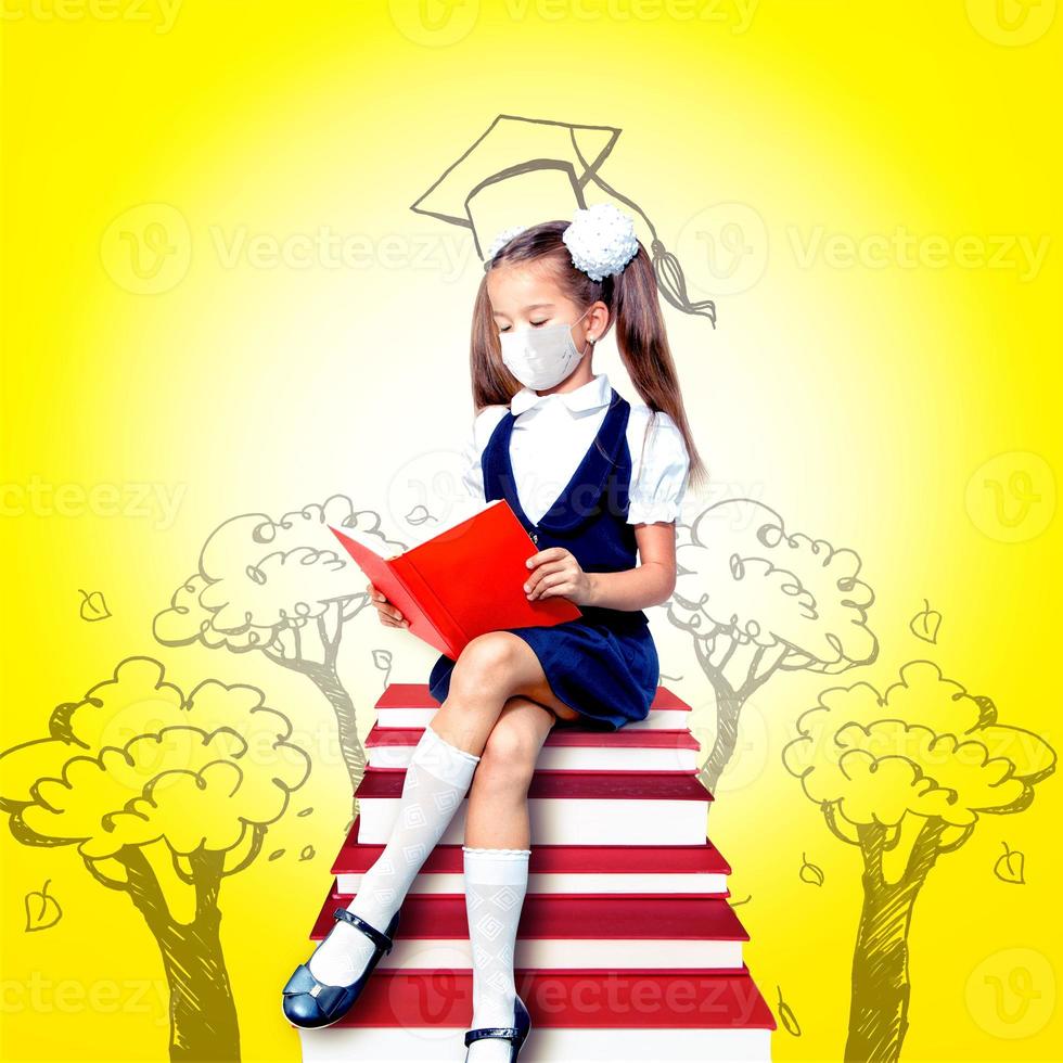 Young girl with protection mask against corona virus at school. photo