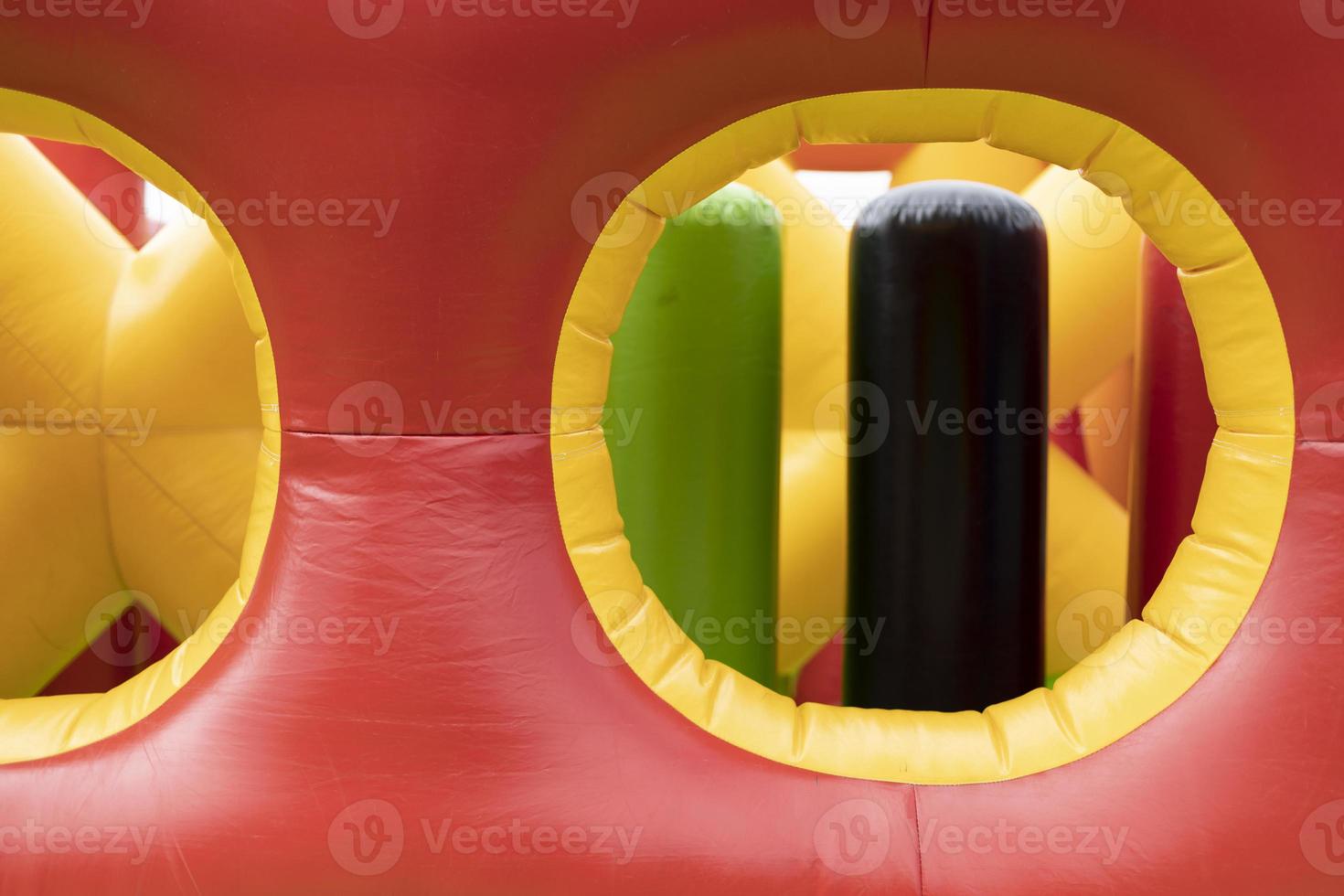 Obstacle course is red. Inflatable amusement park. Attraction for children. photo