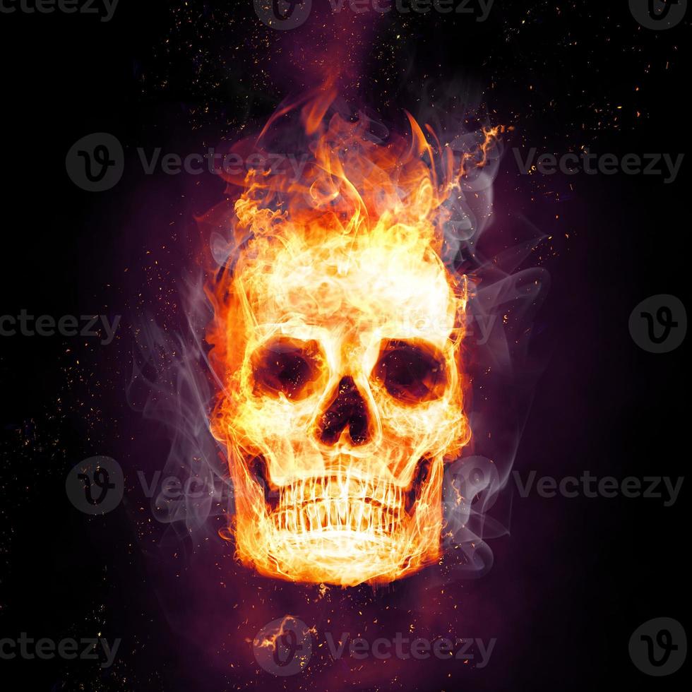 Burning skull in flames in the darkness photo