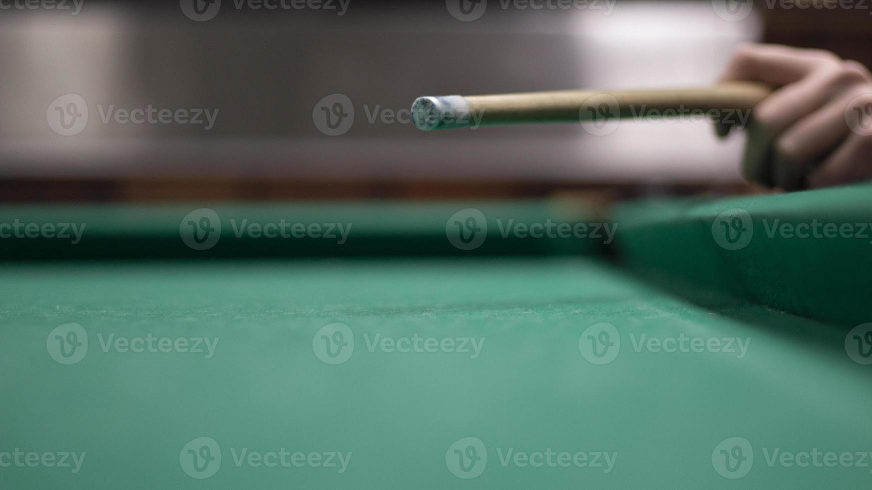 Billiard balls are white. Green billiard table. Playing in bar. Sports competition. photo