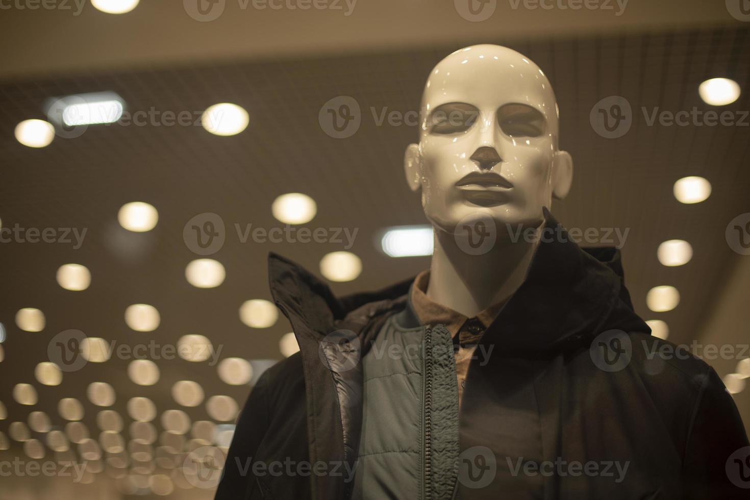 Men's mannequin in a jacket. Outerwear in the store. Showcase of men's clothing store. Details of modern fashion. photo