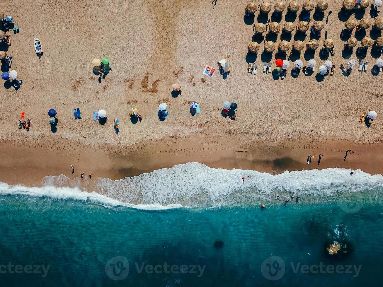 Beach with sun loungers on the coast of the ocean photo