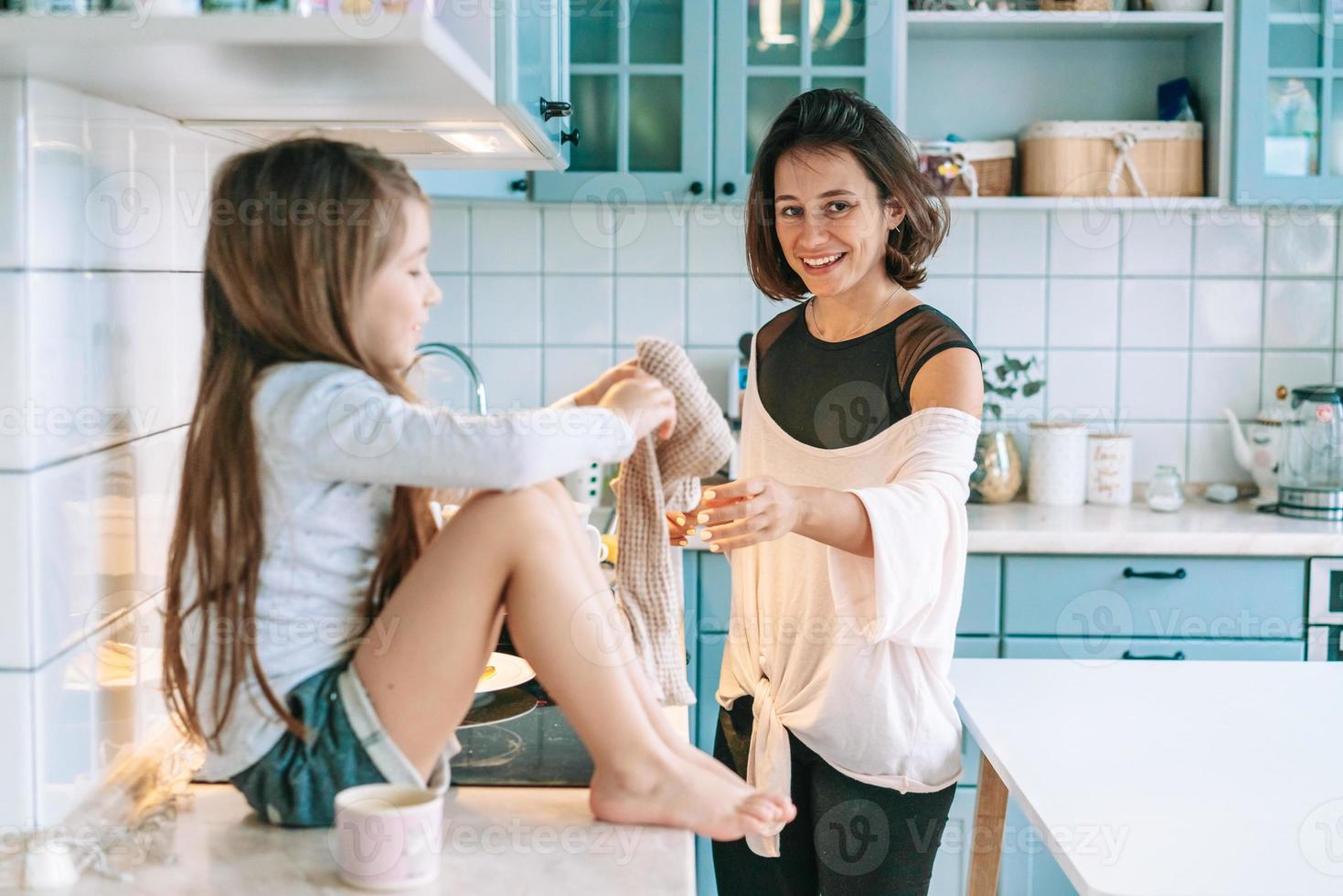 happy family cook together in the kitchen photo