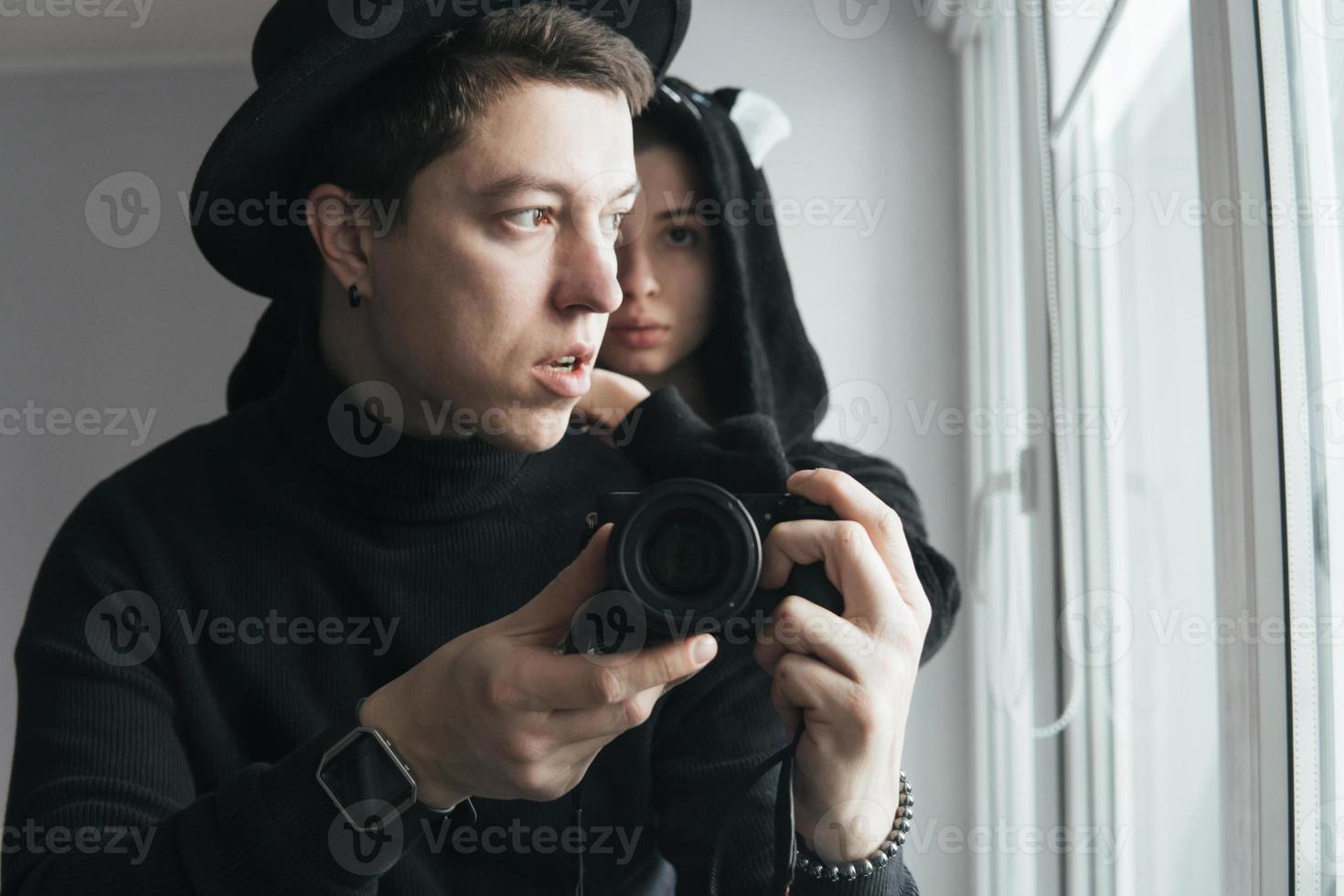man and woman in black clothes photo