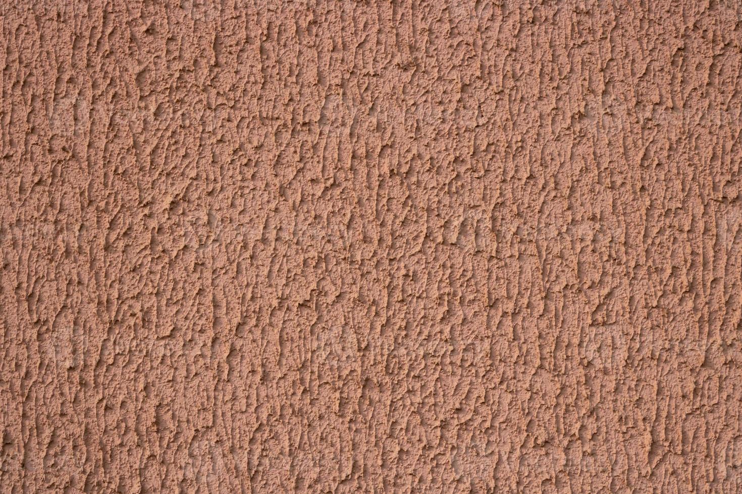 Textured background. Decorative plaster walls, external decoration of facade. Texture of beige photo