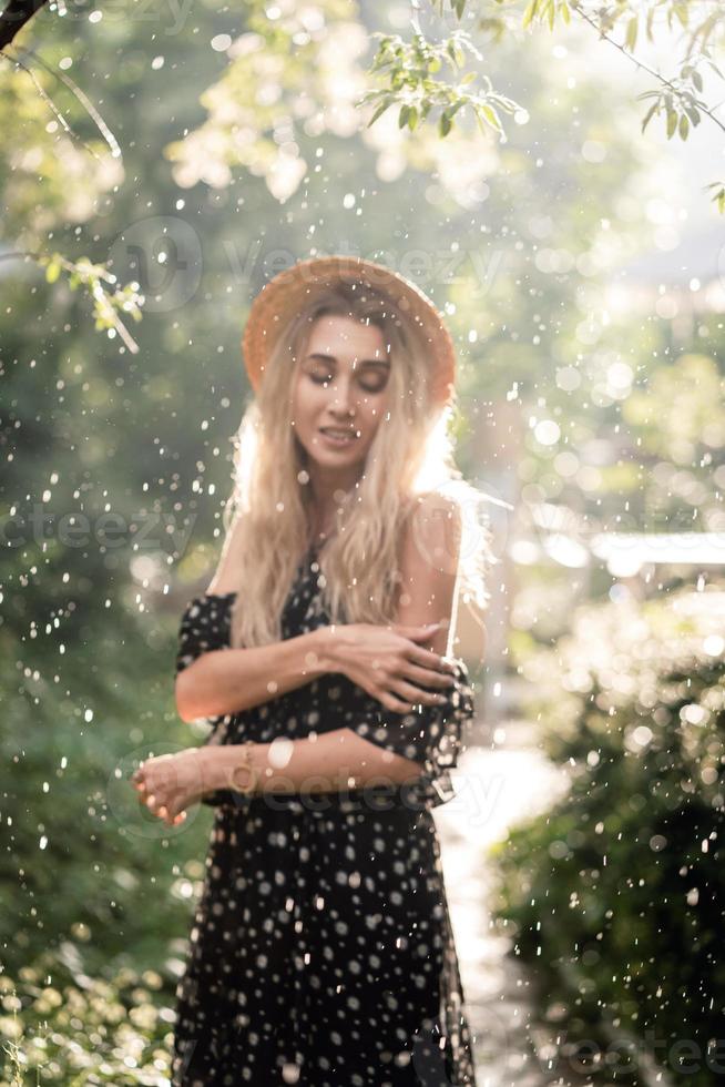Girl in hat posing on camera photo