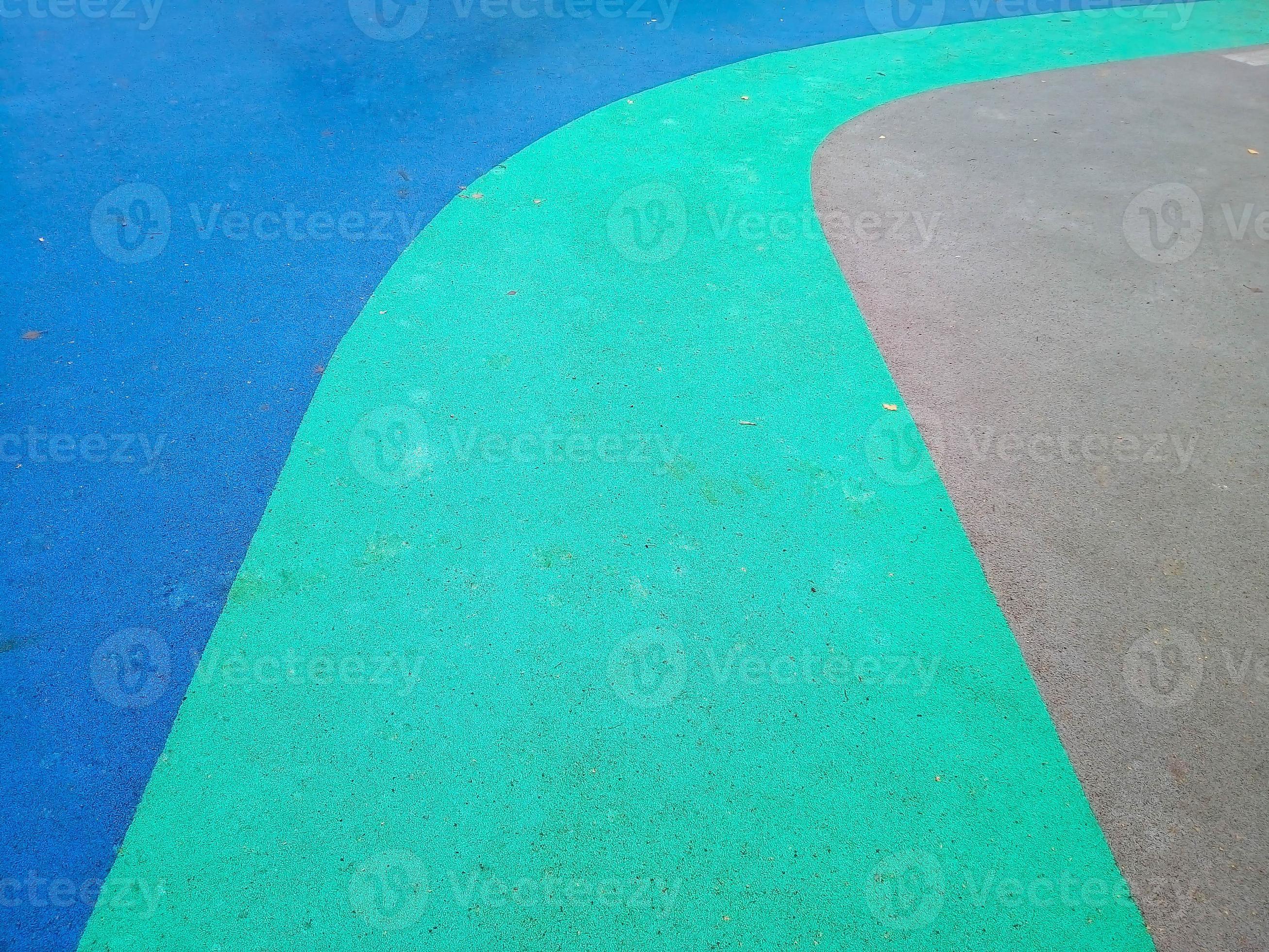 Colorful playground background. Grey-blue rubber outdoor playground
