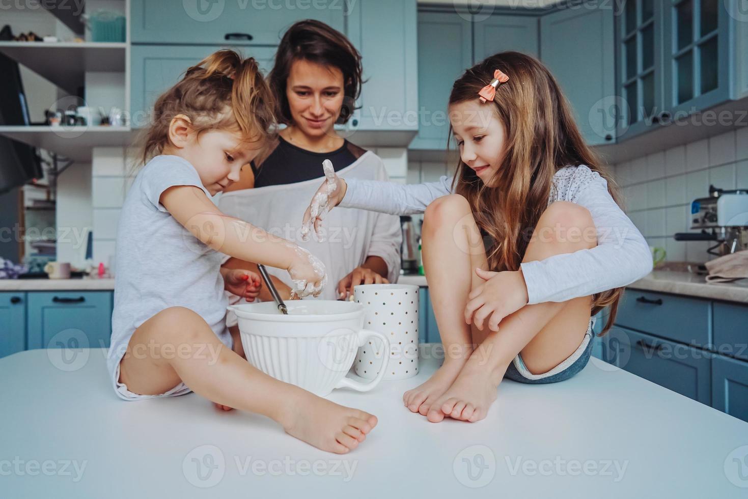 Happy family cook together in the kitchen photo