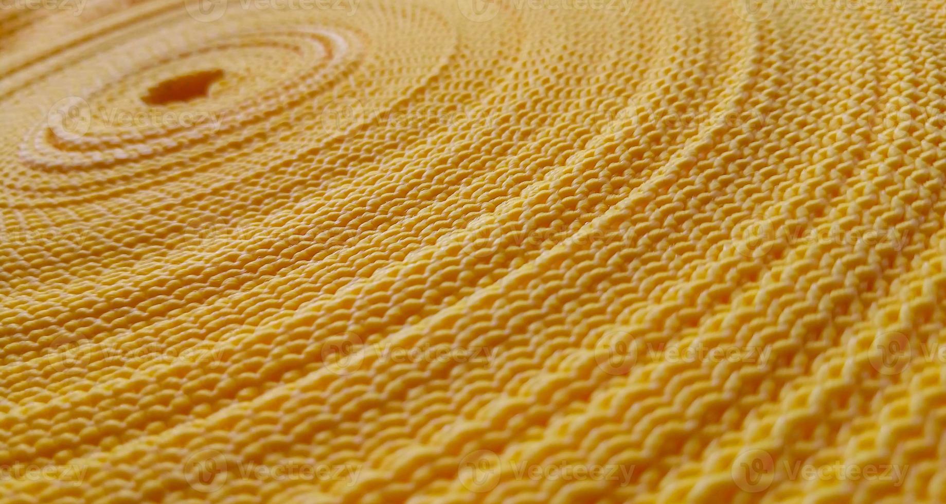 Beautiful yellow abstract background. Circular pattern of yellow sling photo