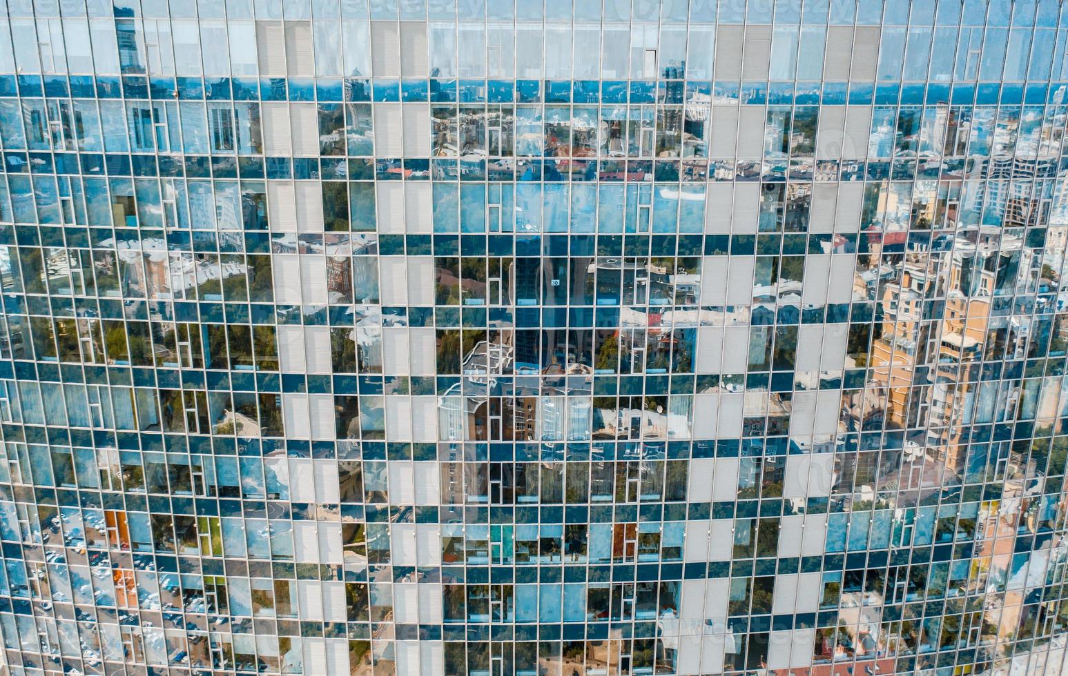 Street reflection on glass steel building facade photo