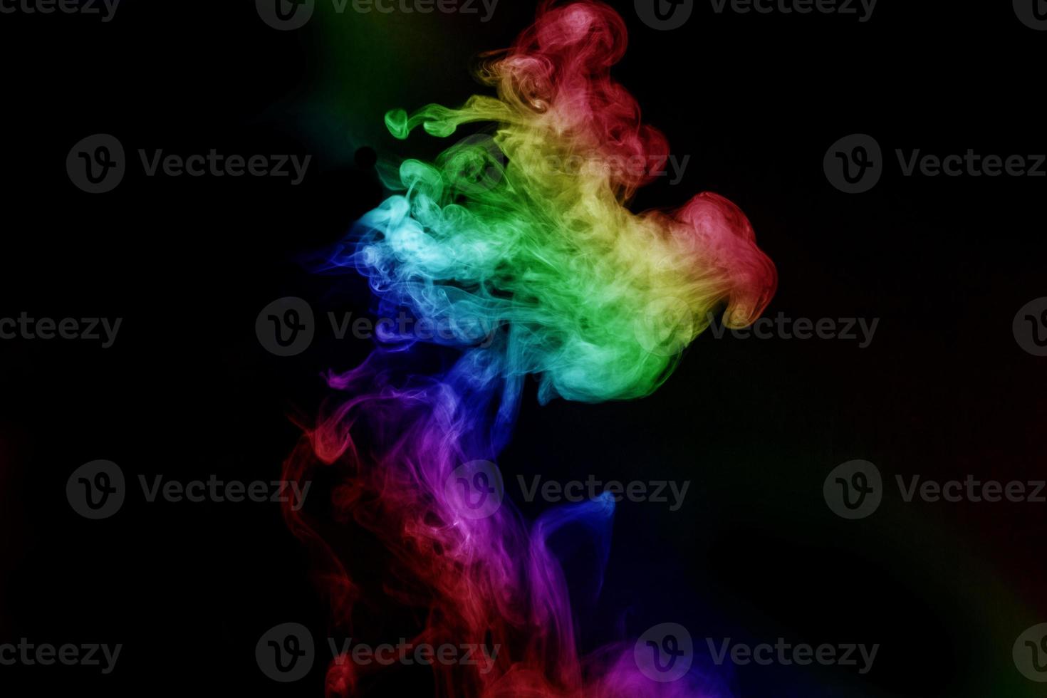 Abstract smoke isolated on black background,Rainbow powder photo