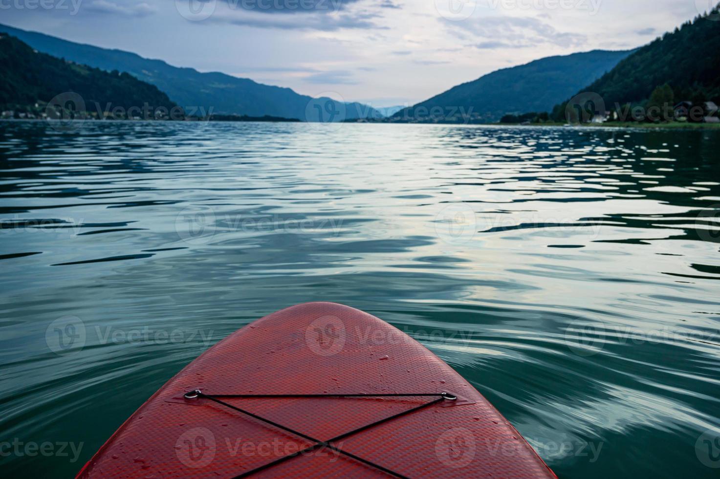 red Sup board cut out on lake Ossiach in Austria photo